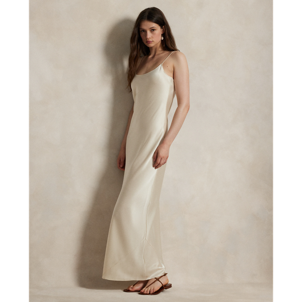 Cut on the bias, this double-faced satin slip dress has an elongated, flared silhouette with a fluid drape and adjustable spaghetti straps for a customisable fit.