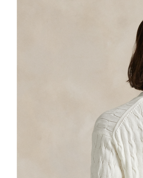 Celebrating  Ralph Lauren Lauren's 20th anniversary in partnership with the US Open, this V-neck cardigan is part of our 2025 US Open Tennis Championships collection and was designed exclusively for the tournament's official umpire uniform. It features the official US Open logo, custom-developed corozo buttons and our signature embroidered Big Pony. The medium-weight layer combines breathable cotton yarn with our iconic cable-knit motif.