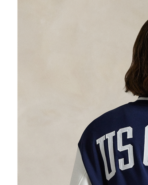 Celebrating  Ralph Lauren Lauren's 20th anniversary in partnership with the US Open, this double-knit jacquard baseball jacket is part of our 2025 US Open Tennis Championships collection. Cut for a relaxed fit with classic striped trim, it features a tennis-inspired logo crest on the chest, custom-developed enamel snaps and "US Open" patches appliquéd on the back.