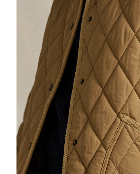 Featuring a quilted construction, this lightly insulated barn jacket is crafted with water-repellent fabric that is accented with cotton corduroy trim and finished with our signature embroidered Pony.