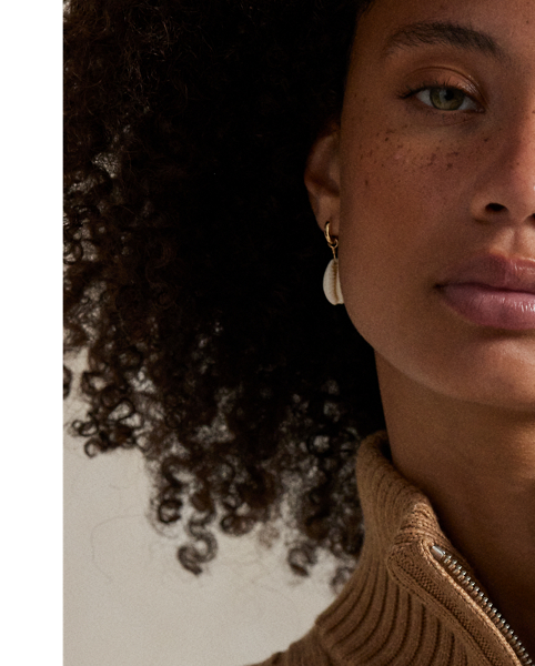 In a relaxed silhouette, this jumper dress is cable-knit with cotton and accented by a half-zip placket. Our signature Pony is embroidered on the chest for pure Polo style.