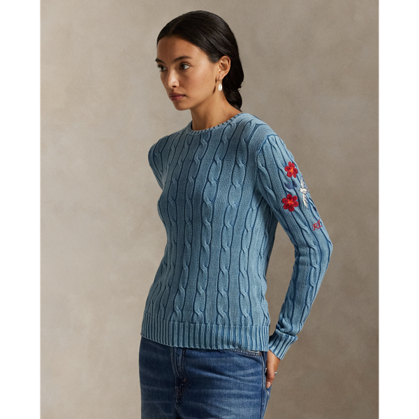 Treated for a high-low effect, this version of our cotton cable-knit jumper features an embroidered motif at the sleeve that unites colourful florals, a dove and  Ralph Lauren Lauren's monogram logo.