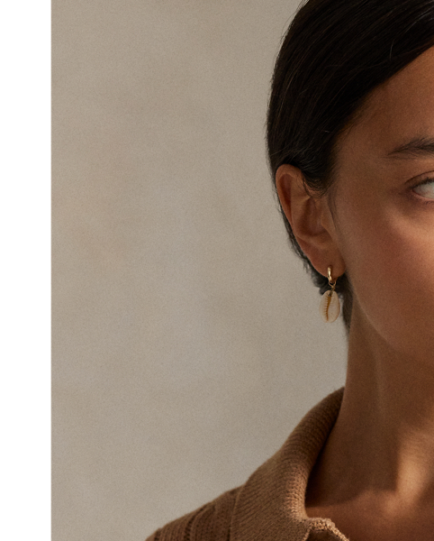 This cotton jumper combines  Ralph Lauren Lauren's signature cable-knit construction with details reminiscent of the classic Polo shirt, including a rib-knit collar and split placket.