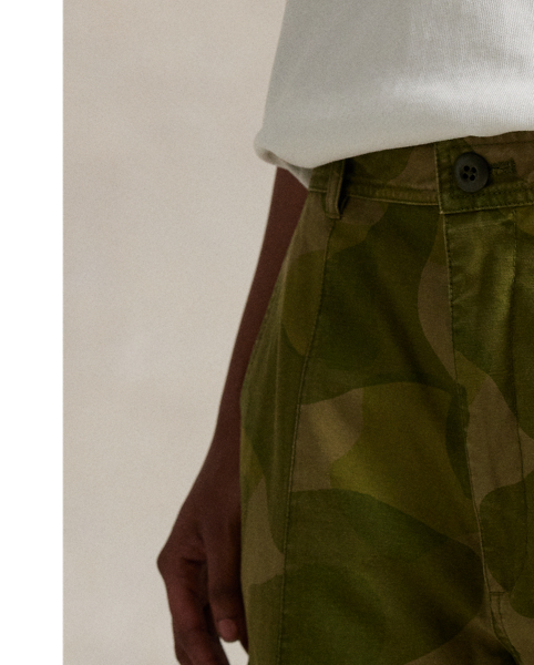 These medium-weight cargo trousers are woven with cotton for a relaxed, curved-leg silhouette and printed with a graphic motif. The panelled construction is detailed with surplus-inspired pocketing.