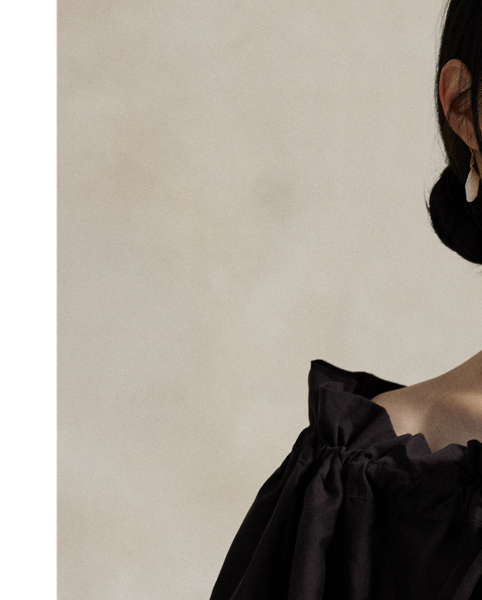 Woven with a blend of cotton and silk yarns, this off-the-shoulder blouse is defined by its relaxed shape and ruffled neckline, which is split at the centre and detailed with self-ties.