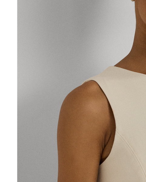 This sleeveless dress is designed with body-shaping princess seams and is crafted with smooth ponte, amplifying its feminine fit-and-flare silhouette.