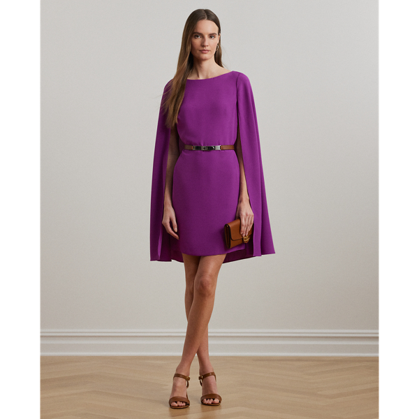 A stylish choice for special occasions, this modern georgette cocktail dress is elevated by a cascading cape, which adds fluid movement to its body-hugging silhouette.