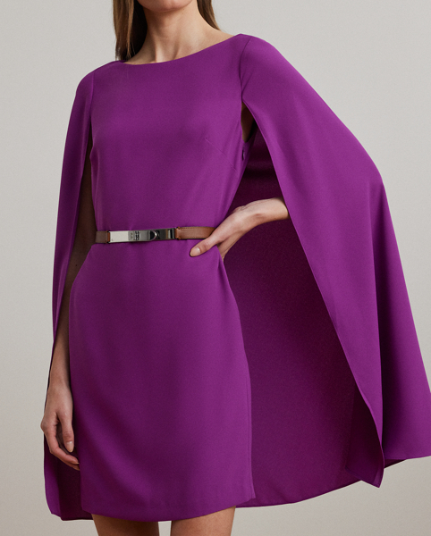 A stylish choice for special occasions, this modern georgette cocktail dress is elevated by a cascading cape, which adds fluid movement to its body-hugging silhouette.
