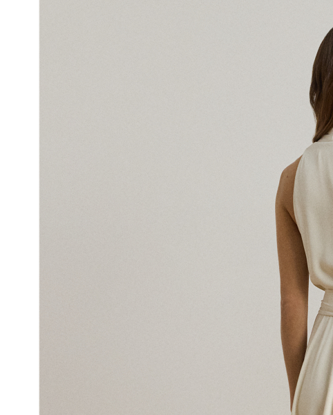 Crafted from airy georgette for an elegant drape, this sleeveless cocktail dress is defined by a halter silhouette and a belted waist. Exuding timeless glamour, it's cut for a calf-grazing midi length and finished with crisp pleats at the shoulders.