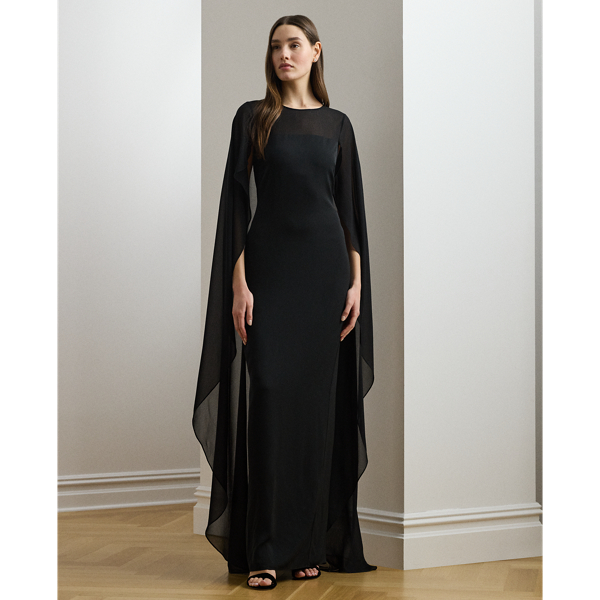 Turn heads at your next event in this glamorous georgette gown, which is designed with a floor-length, semi-sheer cape overlay and a statuesque column silhouette.