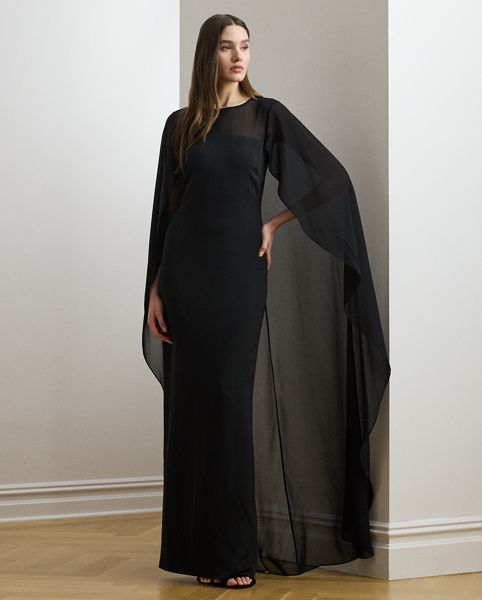 Turn heads at your next event in this glamorous georgette gown, which is designed with a floor-length, semi-sheer cape overlay and a statuesque column silhouette.