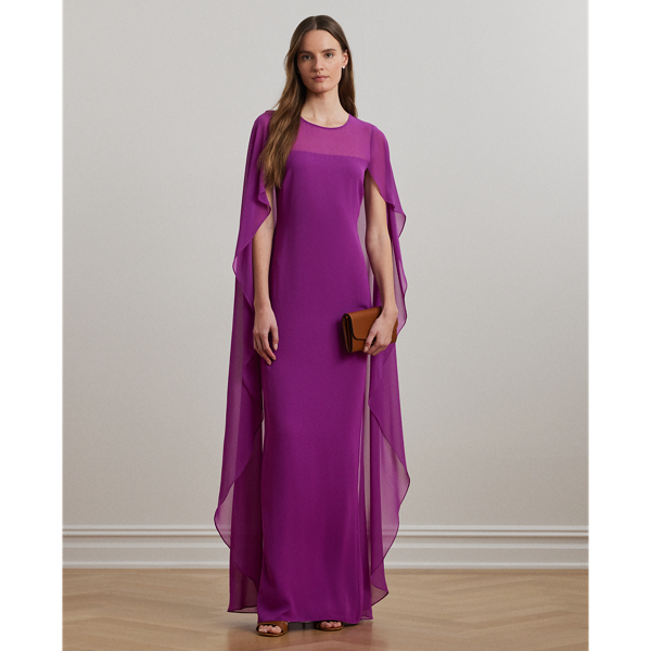 Turn heads at your next event in this glamorous georgette gown, which is designed with a floor-length, semi-sheer cape overlay and a statuesque column silhouette.