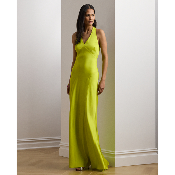 Exuding timeless glamour, this floor-length halter gown is cut from fluid featherweight charmeuse for a luminous sheen and lightweight feel.