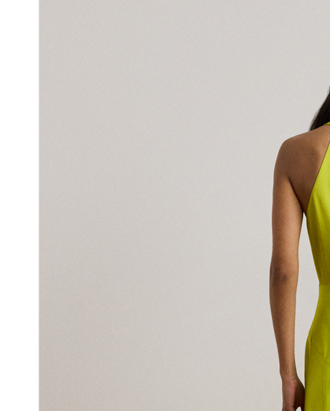 Exuding timeless glamour, this floor-length halter gown is cut from fluid featherweight charmeuse for a luminous sheen and lightweight feel.