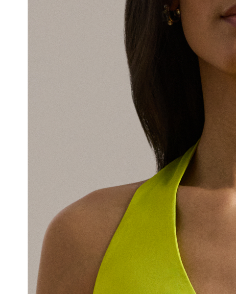 Exuding timeless glamour, this floor-length halter gown is cut from fluid featherweight charmeuse for a luminous sheen and lightweight feel.