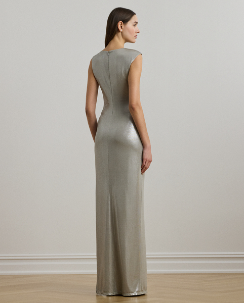 Cut from eye-catching metallic jersey for a fluid drape, this floor-length gown features a statuesque column silhouette and a horseshoe-shaped "LRL"-engraved buckle on the shoulder.