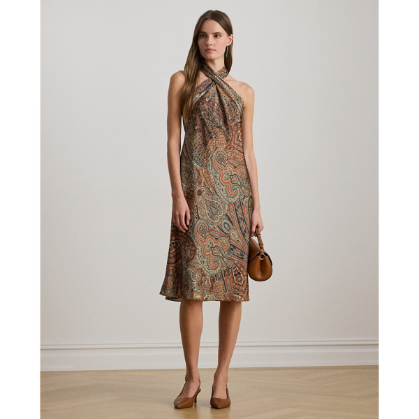 A cascading self-tie detail on the back of the neck heightens the elegance of this paisley halter cocktail dress, which is rendered in satin charmeuse for a fluid drape and lustrous finish.
