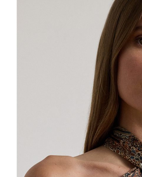 A cascading self-tie detail on the back of the neck heightens the elegance of this paisley halter cocktail dress, which is rendered in satin charmeuse for a fluid drape and lustrous finish.