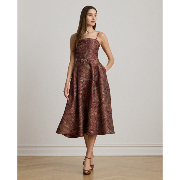 Displaying an elegant paisley motif, this sleeveless cocktail dress is crafted from jacquard for a subtle sheen and structured look. A self-belt with an equestrian-inspired buckle accentuates its fit-and-flare silhouette, completing the look.