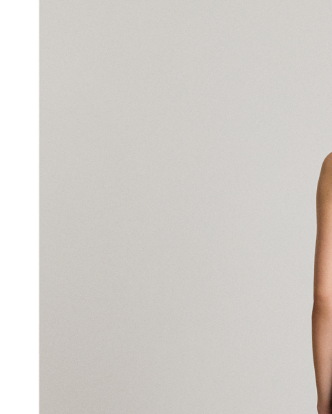 Satin-faced crepe brings an elegant drape to the wide-leg silhouette of this one-shoulder jumpsuit, while self-ties form a bow on the strap for a feminine finish.