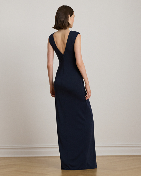 Embodying Ralph Lauren Lauren's elegant sensibility, this cap-sleeve gown is designed with an open V-back and an equestrian-inspired buckle-and-chain embellishment on the waist. This style's column silhouette is crafted from smooth stretch jersey for a graceful drape.