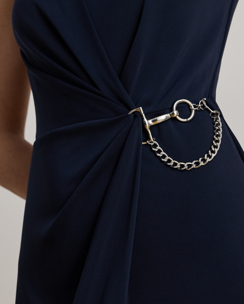 Embodying Ralph Lauren Lauren's elegant sensibility, this cap-sleeve gown is designed with an open V-back and an equestrian-inspired buckle-and-chain embellishment on the waist. This style's column silhouette is crafted from smooth stretch jersey for a graceful drape.