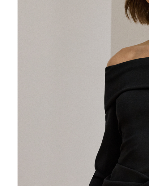 Timeless and elegant, this column gown combines a rib-knit off-the-shoulder bodice with a wrap-style crepe skirt.