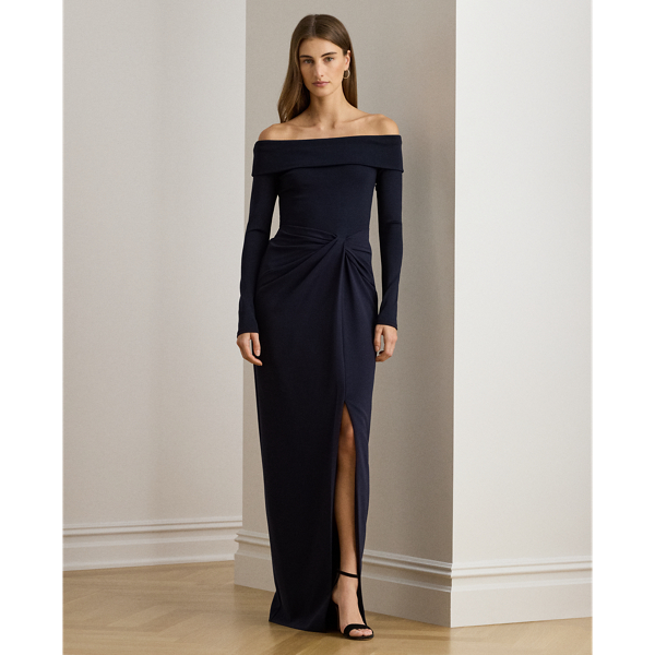 Timeless and elegant, this column gown combines a rib-knit off-the-shoulder bodice with a wrap-style crepe skirt.