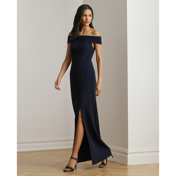 Evoking timeless glamour, this off-the-shoulder gown is designed with thoughtfully placed vertical seams, which accentuate its statuesque column silhouette. A slit on the skirt and smooth, stretch-infused crepe afford ease of movement.