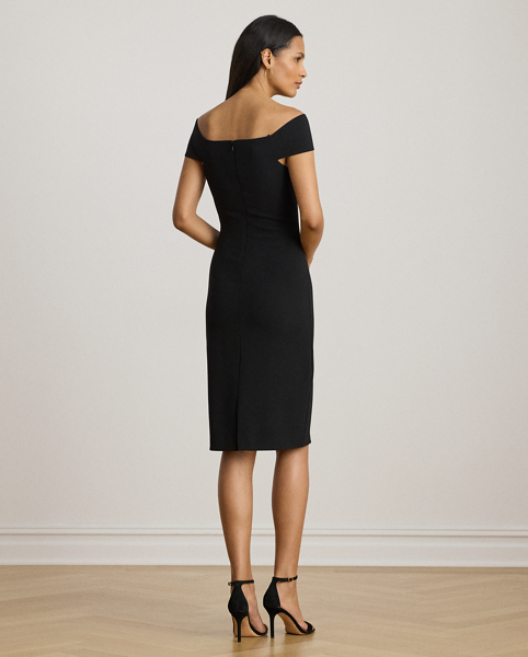 Distinguished by a twist-front off-the-shoulder neckline, this refined cocktail dress features a sheath silhouette crafted from smooth, stretch-infused crepe.