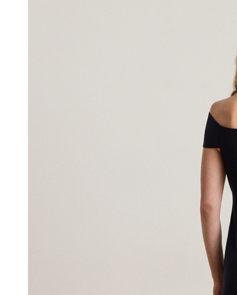 Distinguished by a twist-front off-the-shoulder neckline, this refined cocktail dress features a sheath silhouette crafted from smooth, stretch-infused crepe.