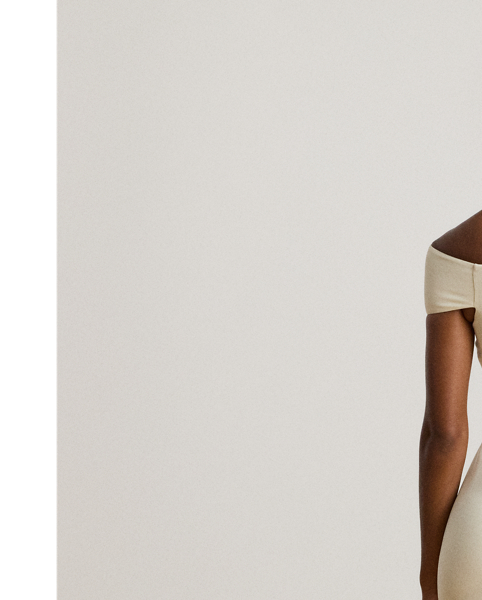 Distinguished by a twist-front off-the-shoulder neckline, this refined cocktail dress features a sheath silhouette crafted from smooth, stretch-infused crepe.
