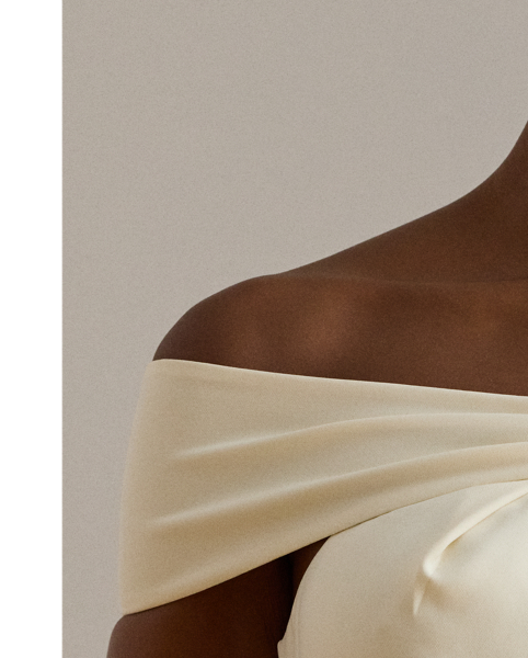 Distinguished by a twist-front off-the-shoulder neckline, this refined cocktail dress features a sheath silhouette crafted from smooth, stretch-infused crepe.