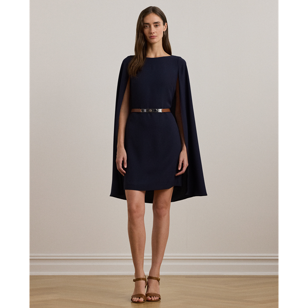 A stylish choice for special occasions, this modern georgette cocktail dress is elevated by a cascading cape, which adds fluid movement to its body-hugging silhouette.
