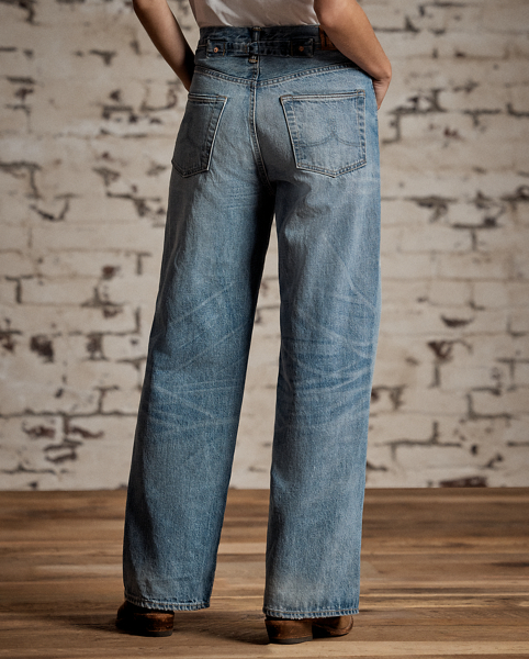 Relaxed-fitting, wide-leg jeans made from 14 oz. Japanese denim. 3x1 left-hand twill is dyed with true indigo. Light wash. Dried using a specially crafted process for an authentic timeworn appearance. Adjustable buckled back and other detailing inspired by denim styles from the late 1930s.
