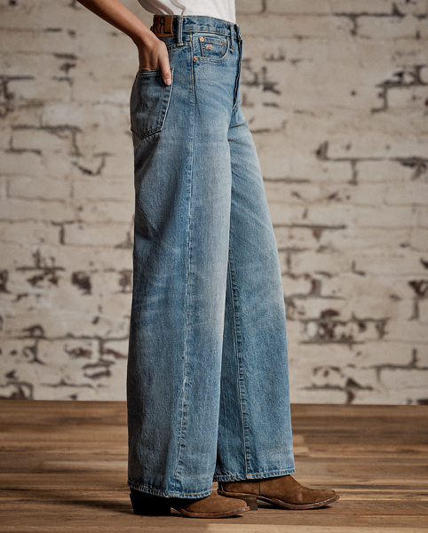 Relaxed-fitting, wide-leg jeans made from 14 oz. Japanese denim. 3x1 left-hand twill is dyed with true indigo. Light wash. Dried using a specially crafted process for an authentic timeworn appearance. Adjustable buckled back and other detailing inspired by denim styles from the late 1930s.