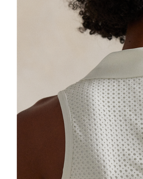 Crafted with interlock fabric for a cropped silhouette, this sleeveless performance Polo has a generous amount of stretch for superior recovery. It's finished with a perforated back panel and our signature RLX logo.