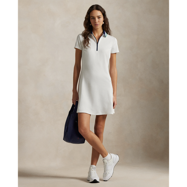 Princess seams enhance the A-line silhouette of this stretch piqué dress, which features a striped knit Polo collar and quarter-zip placket.