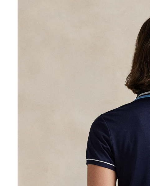 Crafted with jersey that has been washed for softness, this Tailored Fit Polo shirt is detailed with striped tipping and piped trim. It combines our signature embroidered Pony with our RLX logo in printed and engraved forms.