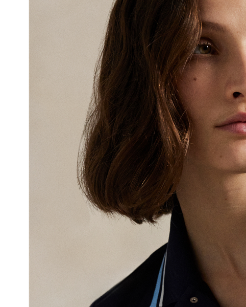 Crafted with jersey that has been washed for softness, this Tailored Fit Polo shirt is detailed with striped tipping and piped trim. It combines our signature embroidered Pony with our RLX logo in printed and engraved forms.