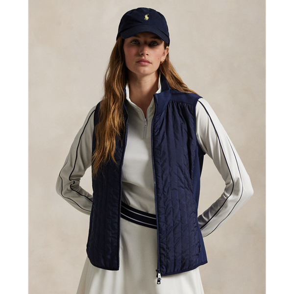 Merging lightweight French terry crafted with wool yarns and an insulated quilted front panel, this hybrid gilet is designed to provide season-spanning warmth and protection from the elements. It features a two-way zip front and zip pockets at the waist.