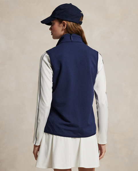 Merging lightweight French terry crafted with wool yarns and an insulated quilted front panel, this hybrid gilet is designed to provide season-spanning warmth and protection from the elements. It features a two-way zip front and zip pockets at the waist.