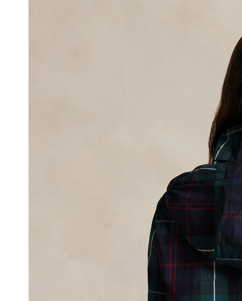 Designed to keep you shielded from wind and rain, this lightweight plaid jacket is made from water-repellent fabric and features a zip-off hood and a mesh-lined back vent for breathability.