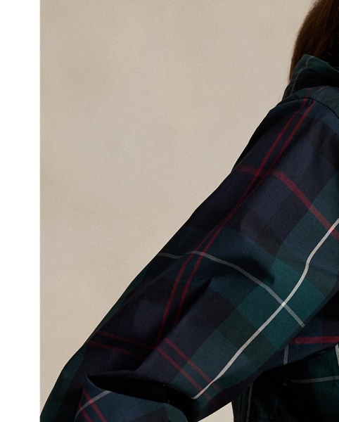 Designed to keep you shielded from wind and rain, this lightweight plaid jacket is made from water-repellent fabric and features a zip-off hood and a mesh-lined back vent for breathability.