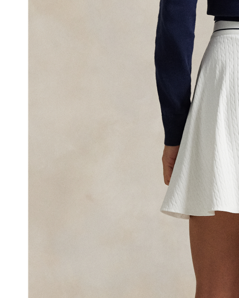 Double-knit jacquard fabric with a cable motif defines this A-line skirt, which features a striped elasticised waist accented by our "RLX" logo.