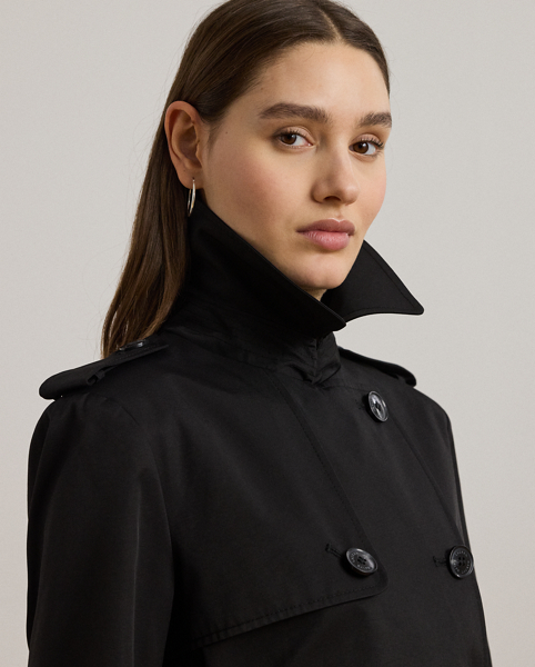 Rendered in a soft cotton blend, Lauren's take on the trench coat showcases traditional styling details, including a double-breasted silhouette and buttoned shoulder epaulets. A buckled self-belt accentuates the waist, while "Lauren Ralph Lauren Lauren"-engraved horn-effect buttons lend a signature finish.