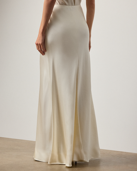 The Masina skirt is designed with an elegant floor-sweeping silhouette and masterfully cut in Italy with stretch-infused satin, which is coveted for its beautiful sheen and fluid drape.