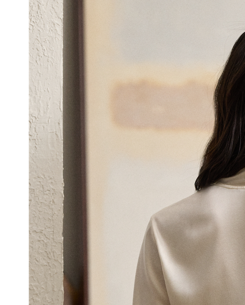 Crafted in Italy from stretch-infused silk charmeuse for a beautiful hand and a luxurious drape, the Shea blouse is designed with an array of romantic elements, including a convenient wrap closure, slightly relaxed long sleeves with genuine mother-of-pearl buttons and a shawl-style neckline.