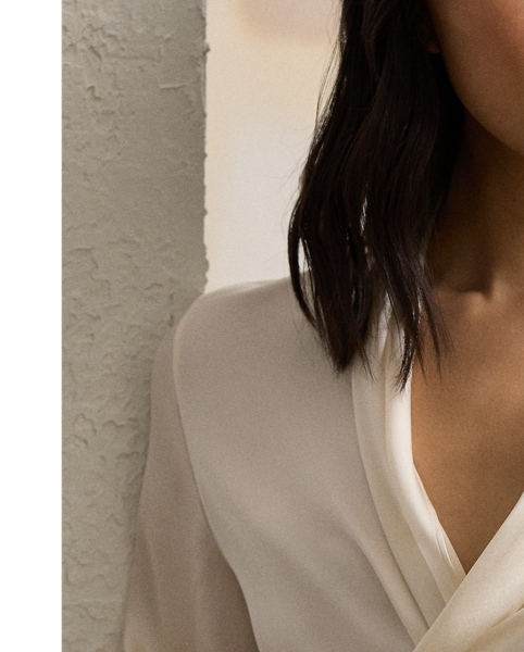 Crafted in Italy from stretch-infused silk charmeuse for a beautiful hand and a luxurious drape, the Shea blouse is designed with an array of romantic elements, including a convenient wrap closure, slightly relaxed long sleeves with genuine mother-of-pearl buttons and a shawl-style neckline.