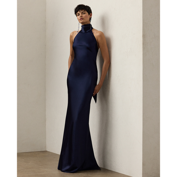 Originating in Spring 2023, the Chilton showcases Mr Lauren's ability to transform timeless silhouettes into modern designs. Crafted in Italy with stretch-infused satin, which is coveted for its beautiful sheen and fluid drape, this evening gown is distinguished by a halter silhouette with self-ties, which cascade beautifully down its dramatic open back.
